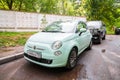 Mint Fiat 500 three door hatchback parked on the street in the city. Front side view of small car Royalty Free Stock Photo