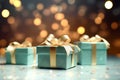 Mint gift boxes with golden bows on the background of bokeh effect.