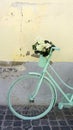 Mint green bicycle with white flowers