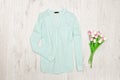 Mint green blouse and bouqet of tulips. Fashionable concept