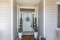 Mint green front door with transom window and two side panels