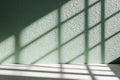 Mint Green Wall Bathed in Soft Morning Light, Creating Shadow Grids for a Refreshing Spring Interior Royalty Free Stock Photo