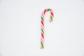 Mint hard candy cane striped in Christmas colours isolated on a white background. Closeup Royalty Free Stock Photo