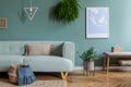 Mint sofa in stylish and cosy living room.