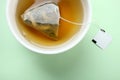 Mint tea bag in a cup Royalty Free Stock Photo