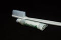 Mint toothpaste and white Tooth Brush Isolated in black background Royalty Free Stock Photo