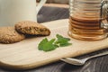 Mint on a wooden board with cookies and tea/mint on a wooden board with cookies and tea. Selective focus Royalty Free Stock Photo