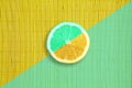 Mint and yellow colors citrus lemon slice on mint and yellow bamboo texture Royalty Free Stock Photo