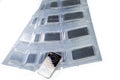 Minted silver bars weighing one troy ounce in plastic packaging and unpacked. Royalty Free Stock Photo