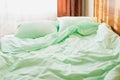 Minty green bedding on the bed