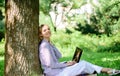 Minute for relax. Education technology and internet concept. Girl work with laptop in park sit on grass. Natural Royalty Free Stock Photo