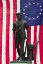 Minuteman Statue and US Flag Royalty Free Stock Photo