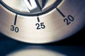 25 Minutes - Macro Of An Analog Chrome Kitchen Timer With Dark Background And Reflection Royalty Free Stock Photo