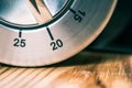 20 Minutes - Macro Of An Analog Chrome Kitchen Timer On Wooden Table