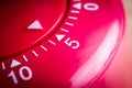 5 Minutes - Macro Of A Flat Red Kitchen Egg Timer Royalty Free Stock Photo