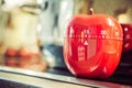 15 Minutes - Red Kitchen Egg Timer On Cooktop Next To A Pot Royalty Free Stock Photo