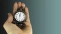 5 minutes to 12 o`clock. Old pocket watch in young woman`s hand. Copy space area for text. Royalty Free Stock Photo