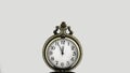 5 minutes to 12 o`clock on a old vintage pocket watch on a white background. Copy space for advertising. Royalty Free Stock Photo