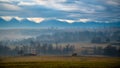 Mioritic landscaoe with tiny house and mountains in the background Royalty Free Stock Photo