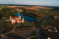 Mir orange castle with spiers near the lake a top view in Belarus in Nesvizh Royalty Free Stock Photo