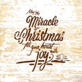 Miracle Christmas lettering on wooden background