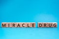 miracle drug inscription wooden cubes with letters