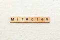 miracles word written on wood block. miracles text on cement table for your desing, concept Royalty Free Stock Photo