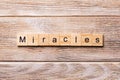 Miracles word written on wood block. miracles text on wooden table for your desing, concept Royalty Free Stock Photo