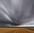 A Mirage on high speed. Thunderstorm above fields Royalty Free Stock Photo