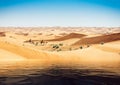 Mirage of the water in the Arabian desert. Camels in background