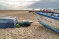 Fishing boats damaged by storms stranded on Aguda beach, Porto