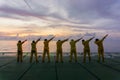 Unidentified people working oil and gas industrial enjoy the moment during sunset. Royalty Free Stock Photo