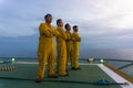 Unidentified people working oil and gas industrial enjoy the moment during sunset. Royalty Free Stock Photo