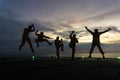 Unidentified people working oil and gas industrial enjoy the moment during sunset. Royalty Free Stock Photo