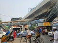 Mirpur, Dhaka, Bangladesh - 03.20.2023: Busy streets and traffic in the Road of Mirpur 10, Dhaka. Rickshaws and people crossing