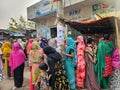 Mirpur, Dhaka, Bangladesh - 03.20.2023: People standing in queue at Mirpur, Dhaka, Bangladesh for food and groceries. Poor people