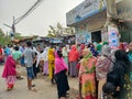 Mirpur, Dhaka, Bangladesh - 03.20.2023: People standing in queue at Mirpur, Dhaka, Bangladesh for food and groceries. Poor people