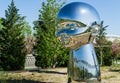 Mirror art object by sculptor Ken Kelleher Inner Child. Big baby heads with smiling faces in Public landscape city park Krasnodar