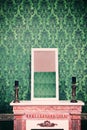 Mirror on chimney in room with vintage retro pattern wall Royalty Free Stock Photo