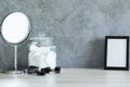 Mirror, cotton pads, frame and barettes Royalty Free Stock Photo