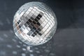 Mirror disco ball on black background. Brilliant decoration, silver decor. Royalty Free Stock Photo