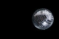 Mirror disco ball on black background. Brilliant decoration, silver decor. Royalty Free Stock Photo