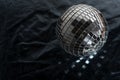 Mirror disco ball on black background. Brilliant decoration, silver decor. Royalty Free Stock Photo