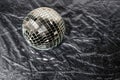 Mirror disco ball on black background. Brilliant decoration, silver decor. Royalty Free Stock Photo