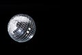 Mirror disco ball on black background. Brilliant decoration, silver decor. Royalty Free Stock Photo