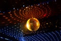 Mirror disco ball with light reflection on the ceiling