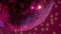 Mirror disco ball in nightclub lights, festive party atmosphere, performance