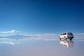 Mirror effect and reflections of a 4x4 car in Salar de Uyuni Uyuni salt flats, Potosi, Bolivia South America