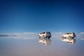 Mirror effect and reflections of 4x4 cars in Salar de Uyuni Uyuni salt flats, Potosi Bolivia, South America Royalty Free Stock Photo