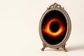 A mirror with an image of a black hole inside. Space for text. Royalty Free Stock Photo